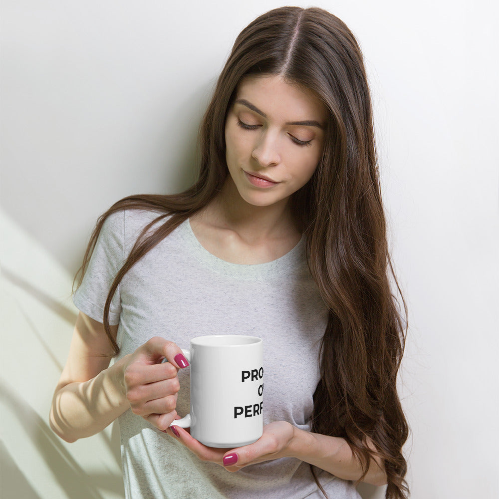 Woman enjoying coffee from progress over perfection motivational mug, ceramic cup for daily affirmation and growth mindset