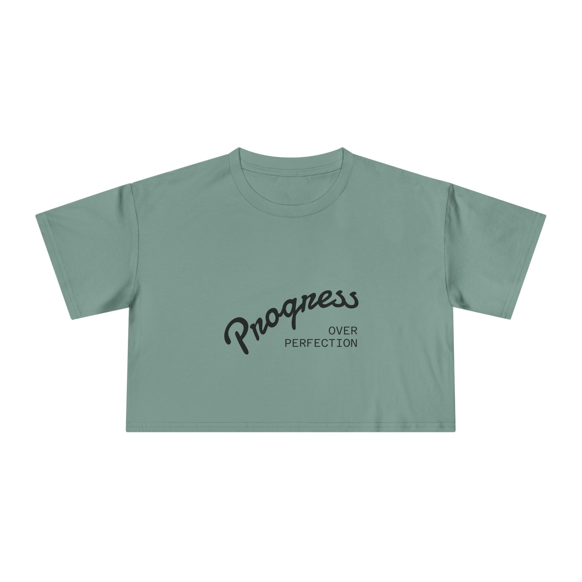 Green t-shirt with 'Progress Over Perfection' text on a white background