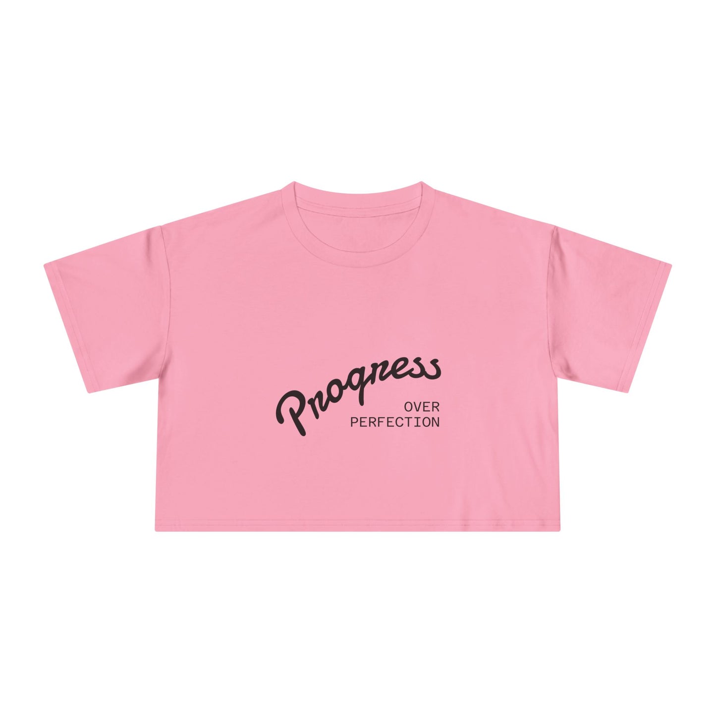 Pink crop top with 'Progress Over Perfection' text on a white background
