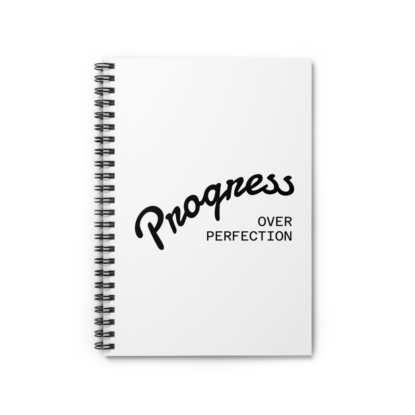 Progress over perfection spiral notebook cover close-up, white motivational journal with black script typography
