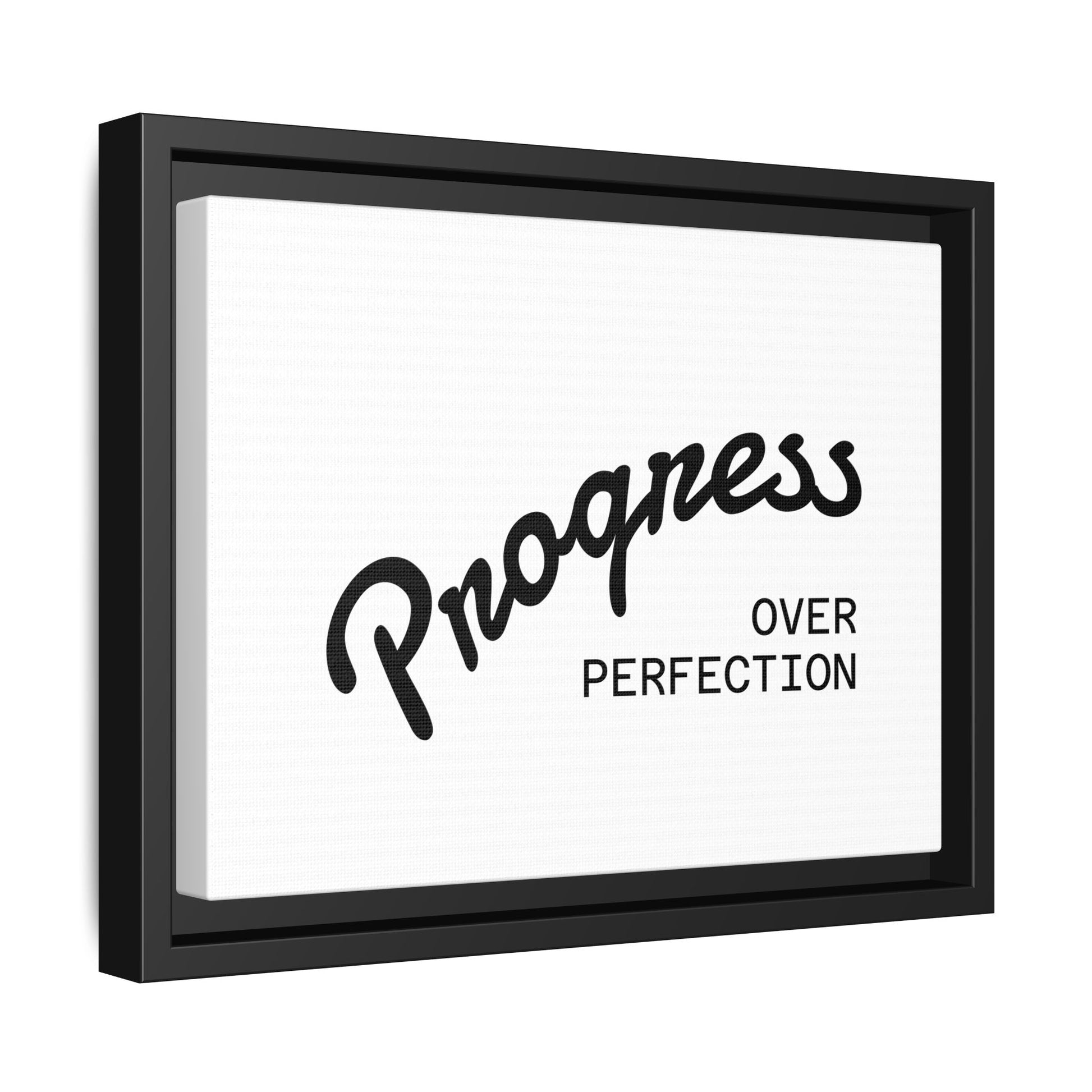 Progress Over Perfection framed canvas angled view black frame white background