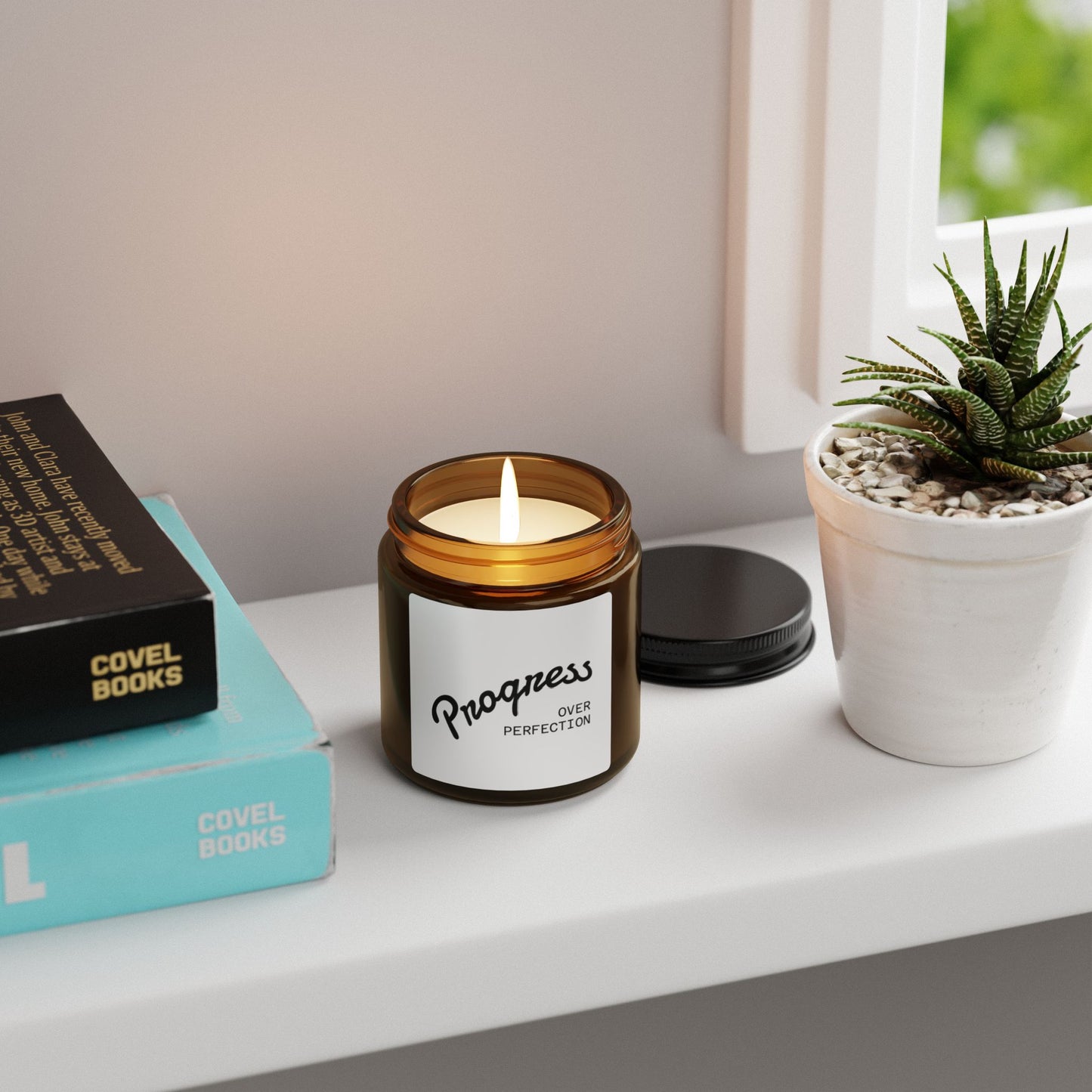 Progress Over Perfection candle on bathroom counter with plants self-care wellness decor