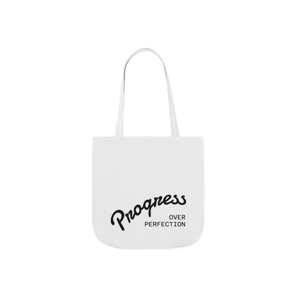 Progress Over Perfection tote bag mockup showing black script typography detail