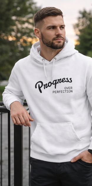 Man wearing Progress Over Perfection white hoodie outdoors casual lifestyle motivational apparel