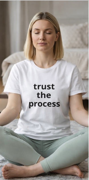 Woman wearing Trust the Process white t-shirt meditating mindfulness motivational lifestyle