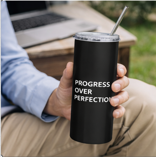 Man holding Progress Over Perfection black tumbler outdoors motivational lifestyle drinkware