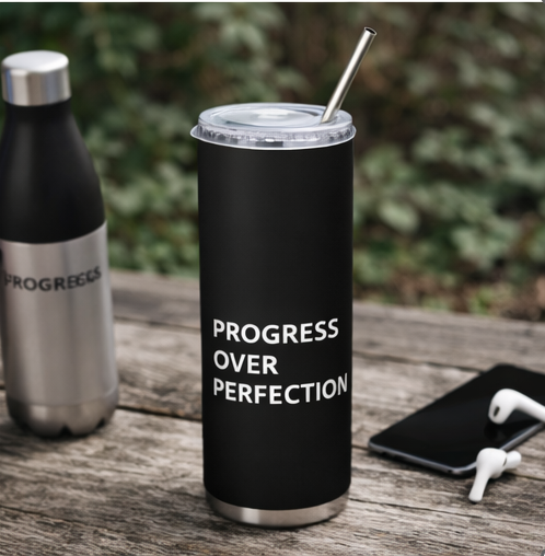 Progress Over Perfection black tumbler with straw on table motivational drinkware