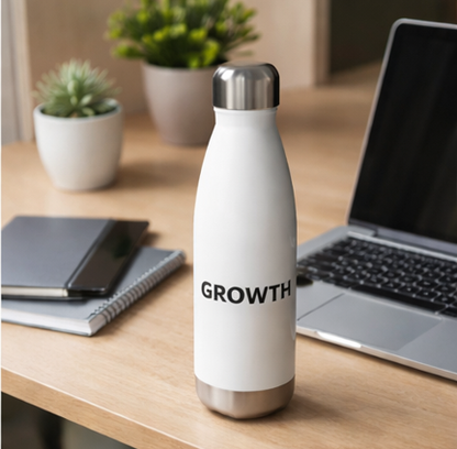 Growth motivational water bottle on modern desk with laptop and plant, white insulated bottle for home office and work
