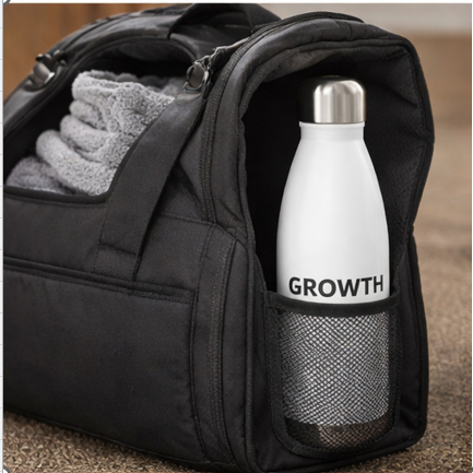 Growth motivational water bottle in black backpack side pocket, portable insulated bottle for gym, travel, and daily use
