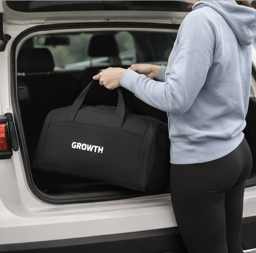 Growth motivational gym bag front view, black duffel bag for fitness and workout essentials
