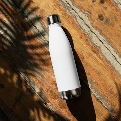 Growth motivational water bottle on wooden background, premium white insulated bottle for gym, office, and outdoor activities
