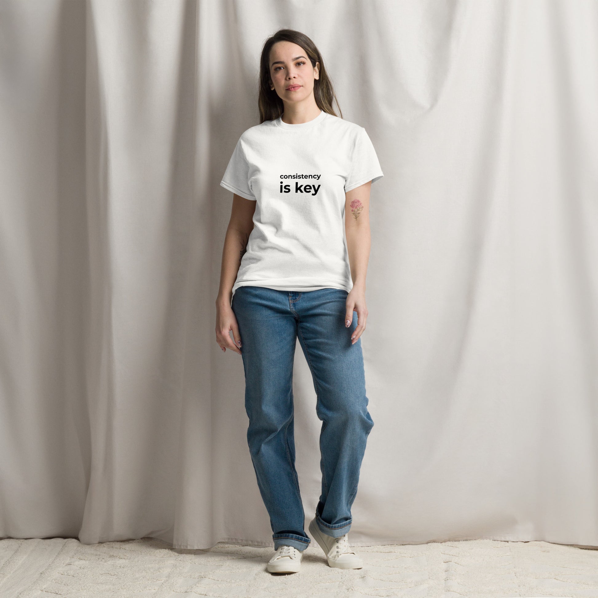 "Consistency is Key" white unisex t-shirt front view motivational apparel